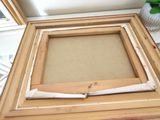 a picture of a picture frame with a piece of paper sticking out of it