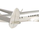 a silver model of a small airplane on a white background