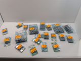 many different types of screws and nuts on the table
