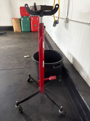 an image of a bucket on a stand in a garage