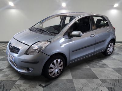 a picture of a silver car parked in a garage