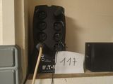 a remote control on the wall next to a box