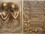 two bronze plaques of two women with musical notes on them