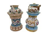 two vases that have been decorated with flowers on them