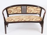 an image of a wooden bench with a patterned upholstered seat