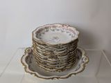 a stack of plates sitting on top of a glass shelf