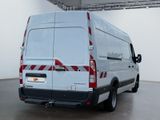a white van with red stripes parked in a room