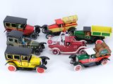 a lot of toy cars that are sitting on a white surface