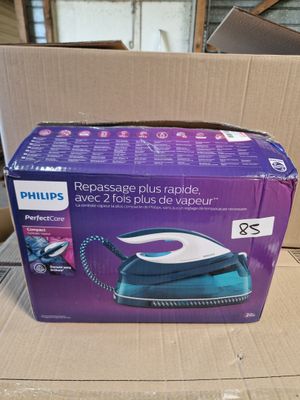 the box is open and ready to be packed with the electric iron