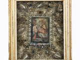 un tableau représentant une femme et un enfant, dans un cadre doré