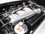 a close up of a car ' s engine with its hood open