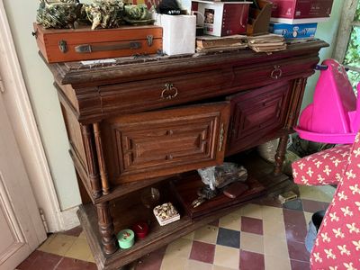 a wooden dresser with a mirror on top of it