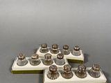 a lot of silver objects sitting on a gray surface