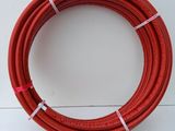a red hose on a white surface