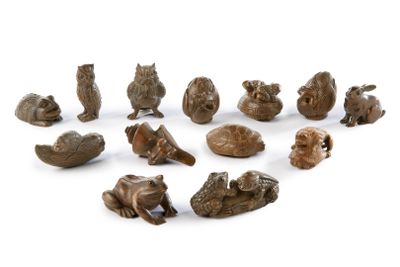 many small figurines of animals on a white surface