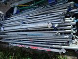 a pile of metal pipes sitting on the ground