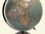a globe that is on a stand on a white background