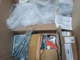 a cardboard box filled with assorted items on the floor
