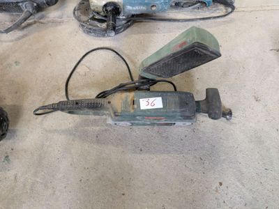 several tools that are sitting on the floor next to each other