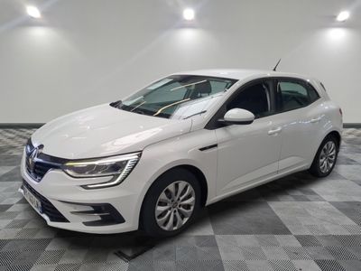 a white car is parked in a room with a checkered floor