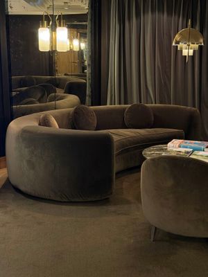 a living room with a couch, chair, and coffee table in it