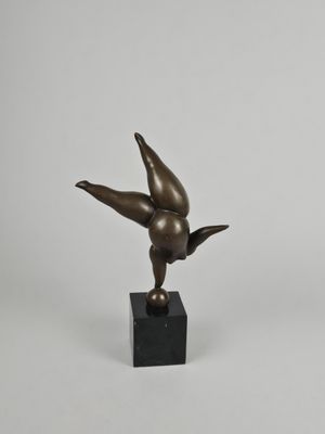 bronze sculpture of a bird on a black marble base