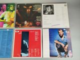 a lot of cd ' s that are on a table