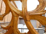 a close up of a wooden chair in a room