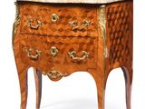 an image of a small chest of drawers with a marble top