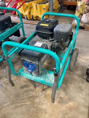 a small green cart with two small engines on it
