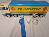 a toy truck that is connected to a cord