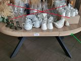 a table that has a lot of cups and mugs on it