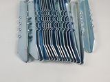 many pieces of metal on a white surface