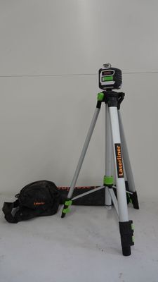 a tripod and a bag on the floor in a room
