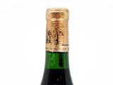 a bottle of wine that is sitting on a table
