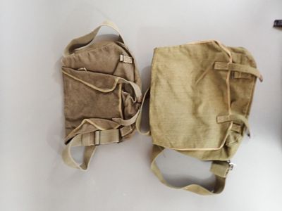 two bags that are sitting on a table