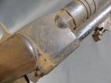 a very old gun that is on display in a museum