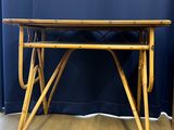 an image of a wooden table with a blue curtain in the background
