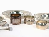 a lot of silver objects on a white surface