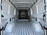 a white van that is parked in a lot