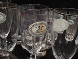 several empty wine glasses are lined up on a table