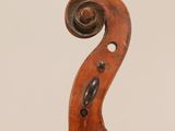 an old violin with a scroll on the back of it