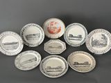 six plates with different designs on them sitting on a table