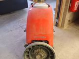 a machine that is sitting on the floor in the garage