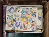 a suitcase with a lot of stamps inside of it