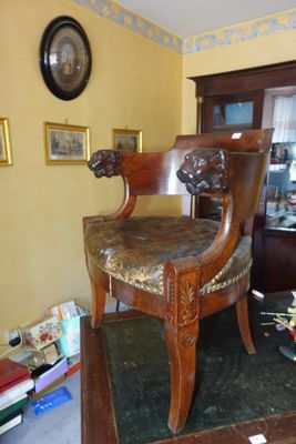 a chair that is sitting in the middle of a room