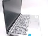 a laptop computer sitting on top of a white table