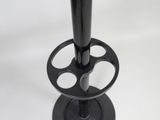 a black candle holder on a white table