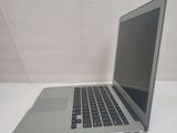 a laptop computer sitting on a table with a white background