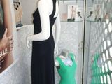 a mannequin in the corner of a room with mannequins on display